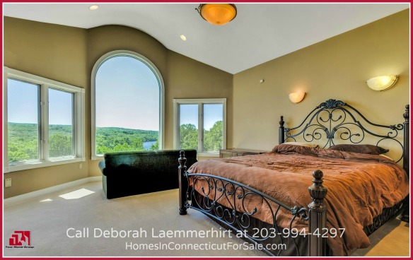Say goodbye to sleepless nights when you set foot in the master suite of this Haddam CT waterfront home with a pool.